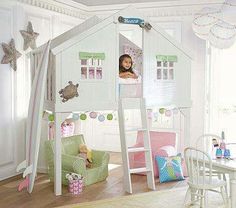 a child's bedroom with a white loft bed and green furniture in the room