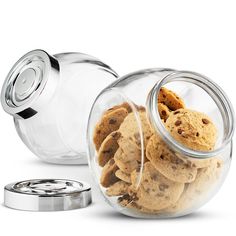 a glass jar filled with cookies next to a metal lid