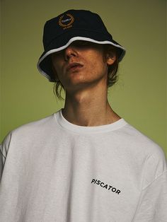 Editor's NotesThis laid-back bucket hat is made from durable cotton and trimmed with contrasting white color along the brim. It has logo with laurel motif embroidery on the front.- Logo embroidery - Stitched brim- Metal eyelets- Contrasting color edgeMeasurements (in.) M / L - Circumference: 22.8 in. / 23.6 in.Composition & Care- 100% Cotton- Refer to the care labelDesigner- by PISCATOR Spring Cotton Hat With Logo Patch, Casual Bucket Hat With Logo Patch And Short Brim, Casual Bucket Hat With Logo Patch And Curved Brim, White Curved Brim Bucket Hat For Streetwear, Casual Bucket Hat With Embroidered Logo And Flat Brim, Casual Bucket Hat With Logo Patch, Cotton Hat With Logo Patch And Short Brim, Cotton Short Brim Hat With Logo Patch, White Cotton Bucket Hat For Streetwear