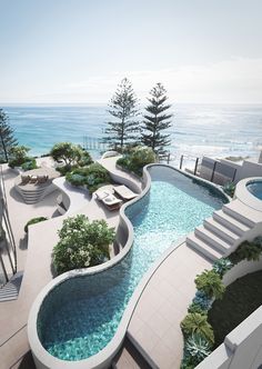 an aerial view of a swimming pool with steps leading up to the water's edge