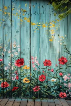 an image of flowers painted on the side of a wooden fence with wood planks