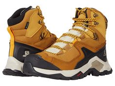 Salomon Quest Element GTX - Men's Shoes : Cumin/Bleached Sand/Saffron : Reach new heights in the stylish Salomon Quest Element GTX hiking boot. Reinforced round toe, lace-up design for custom fit. Durable textile and synthetic upper, man-made lining, padded insole, and man-made traction outsole. Pair with your favorite bold trail pants for a rugged style. Imported. Measurements: Weight: 1 lb 4 oz Shaft: 6 in Product measurements were taken using size 9, width D - Medium. Please note that measure Functional Insulated Lace-up Work Boots, Insulated Rugged Lace-up Sneakers, Functional Insulated Lace-up Hiking Boots, High-top Lace-up Hiking Boots, Outdoor Leather Hiking Boots With Lacing, Sporty Hiking Lace-up Boots, Leather Hiking Boots With Lacing For Outdoor, Functional Lace-up Boots For Outdoor Work, Rugged Outdoor Hiking Boots With Lacing