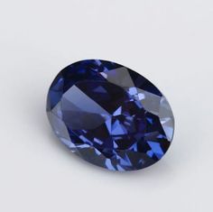 an oval blue diamond on a white background