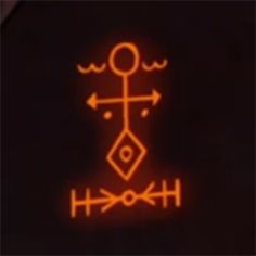 an orange neon sign on the side of a black wall that says, horosh