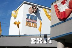 a large sign on the side of a building that says this is an extra fair exit