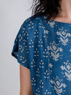 Made with 100% Modal Hand block printed Hand embroidery Length of size S is 23" Made at a fair trade women's cooperative in India The combination of a mixed print and stunning blue color scheme makes the Cara Top an interesting visual piece. Try this relaxed modal top for a versatile option with any outfit. This textile has been printed by hand using traditional techniques. Care: The best option for all Mata pieces is to hand wash in cold water to preserve the fabrics for years. The next best an Stylish Boy Clothes, Block Printed Textiles, Kurti Patterns, Fair Trade Clothing, Japan Outfit, Ethical Fashion Brands, Kurti Neck Designs, Kurta Designs Women, Indian Block Print