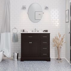 a bathroom with white and black tile flooring