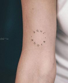 a woman's arm with the word love written in small black letters on it