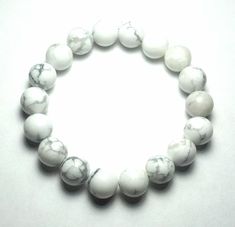 "Material: Quality, Genuine, Natural Howlite gemstones length:1 strand 7.25 inch, 6.25 to 6.5 inches inside circumference unstretched (Please send me Conversation for custom request.) size: 10mm N0.of beads:18pcs shape: round color: White and Grey patterns Howlite is called the \"attunement stone,\" linking the user to higher spiritual consciousness, and opens and prepares the mind to receive the energies and wisdom of attunements. As a stress reducer, Howlite can be helpful in the workplace by Hippie Bracelets, Howlite Stone, Bracelet Love, Yoga Bracelet, Sterling Silver Cross, Beaded Stretch Bracelet, Cz Diamond, Latex Free, Love Gifts