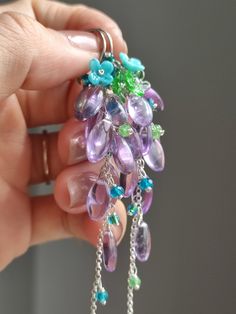 Just like the spring breeze bringing a faint fragrance of grass. Time is slow, everything is gentle and calm. ●amethyst ●apatite ●tsavorite ●seed beads ●925 silver ●total length: 87mm ● weight：6.7g Welcome to visit my Jewelry store: https://www.etsy.com/shop/Ukuly 🌸The delivery time to Most regions of North America, Australia and Europe is usually about 10-15 days. Buyers from Brazil, South Korea, and Indonesia, please provide me with your tax number through messages or notes for smooth shipmen Lavender Amethyst, Spring Breeze, Earrings Purple, Shipping Label, Earrings Unique, Birthday Gift For Her, Cluster Earrings, Floral Earrings, Spring Floral