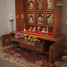 a wooden table topped with lots of different types of items on top of a rug