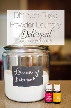 an empty glass jar with some essential oils in it and a sign that says diy non - tonic powder laundry deterant