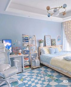 a bedroom with blue walls and white furniture