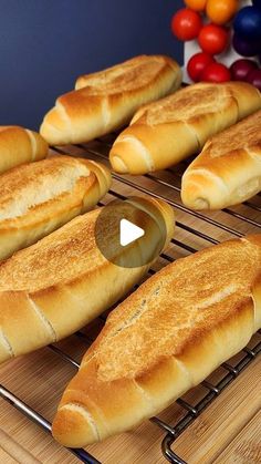 several loaves of bread sitting on top of a cooling rack