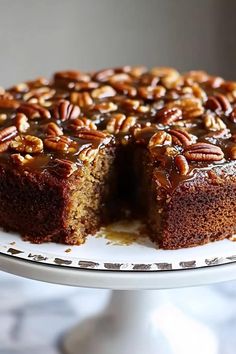 a chocolate cake with pecans on top