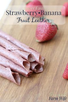 strawberries and bananas on a cutting board with text overlay that reads strawberry banana fruit leather