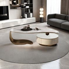 a modern living room with white and gold furniture