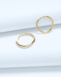 Crafted from 14k gold over sterling silver, our Demi-Fine pieces are future keepsakes meant to be layered and worn every single day (think of them as your jewelry BFFs). These medium huggie hoop earrings are perfect for wearing with anything and everything.Please note: If the closure doesn't clasp properly, carefully bend the post back into place. The function can be recovered if the post is slightly bent up a bit.23 1/2 mm x 24 1/2 mm.100% recycled sterling silver.Do Well: made using recycled f Madewell Jewelry Earrings, Small Hoop Stackable Fine Jewelry Earrings, Stackable Small Hoop Earrings Fine Jewelry, Stackable Small Hoop Earrings In Fine Jewelry, Stackable Yellow Gold Earrings For Gift, Modern Stackable Gold Earrings, Minimalist Gold Huggie Jewelry, Stackable Sterling Silver Hoop Earrings Fine Jewelry, Stackable Sterling Silver Hoop Earrings