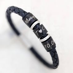 "Personalized Gifts, Birthday Gift Man, Anniversary Gift For Boyfriend, Leather Bracelet For Him, Mum Son Gift, Husband Gift, Boyfriend Gift Braided leather bracelet (black or brown) with personalised black coloured stainless steel rings and silver coloured hoops in between. Each black ring is engraved with your own text, you can choose the number of rings included. The bracelet is available in three lengths to fit a wrist of 6.5\", 7\" (standard) or 7.5\" wrist. If you require a different size, Black Bracelets For Birthday Or Valentine's Day, Personalized Black Wristband For Birthday, Anniversary Gift For Boyfriend, Bracelet For Him, Gift Boyfriend, Gift Husband, Black Ring, Mens Anniversary Gifts, Braided Leather Bracelet