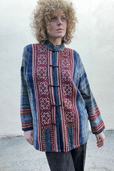 Vintage Blue Embroidered Block Printed Jacket. Stunning vintage top with fabric button closures. Soft lightweight block printed indigo blue cotton with red and brown folk art embroidered panels in front and back and along bottom of sleeves. Delicately hand wash cold. Size L/XL. Fits many. Feels like 100% cotton. Approx. Measurements: Underarm to underarm: 25" Length: 30” Sleeve length: 28” Indigo Cotton Traditional Tops, Traditional Indigo Cotton Top, Traditional Blue Long Sleeve Tops, Traditional Long Sleeve Blue Tops, Traditional Cotton Outerwear With Natural Dye, Blue Embroidered Cotton Outerwear, Traditional Blue Tops For Fall, Long Sleeve Cotton Tops With Woven Motifs, Blue Folk Style Outerwear For Fall