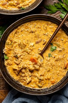 two bowls of chicken and rice soup with chopsticks