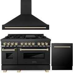 a black stove top oven sitting next to a wall mounted range with two burners