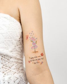 a woman with a small tattoo on her arm