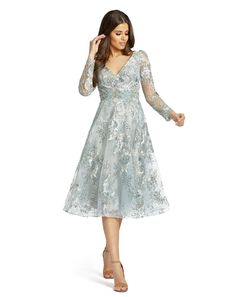 Sheer long sleeve midi dress with floral applique and embroidery. Mac Duggal Partially Lined 100% Polyester Back Zipper V-neck Long Sleeve Midi & Tea Length Approx. length from shoulder to hem: 44" Style #70230