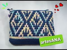 a crocheted purse with the words anaetes on it and an image of two