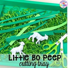 little bo pee cutting tray with scissors and paper strips cut out to look like lambs