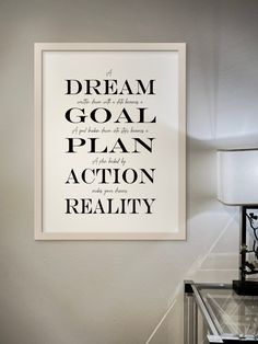 a black and white poster with the words dream, goal, plan, action, reality