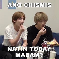 two young men sitting on a couch eating chips and drinking coffee, with the caption saying eating chips