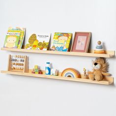 two wooden shelves with books and toys on them