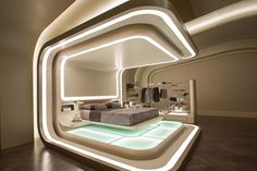 a bed room with a neatly made bed and lights