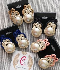 six pairs of hair clips with pearls on them