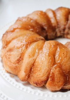 a white plate topped with pastry on top of a table