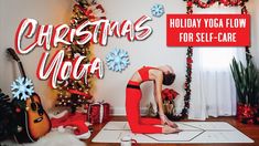 a woman is doing yoga in front of christmas decorations