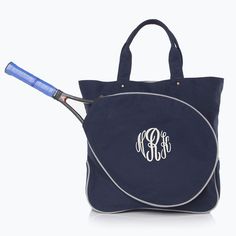 a blue tote bag with a tennis racket sticking out of it's side