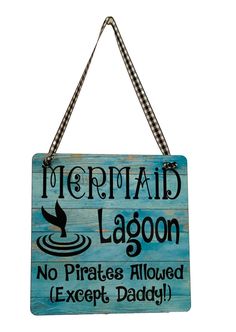 a wooden sign that says mermaid lagoon no pirates allowed except daddy on the front and back