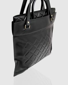 Upgrade your go-to carryall with the sophisticated Lost Lovers Quilted Leather Tote. Crafted from softly quilted genuine leather with a spacious interior, this classic bag will fit all your essentials without compromising on style. - Genuine leather with exclusive quilted texture - Satchel/Shoulder bag strap options - Belle & Bloom printed Nylon lining - Inner phone and zipper pockets- Colour: Black   If any part gets dirty, we recommend wiping and spot-cleaning them with a soft cloth dampened with water. Do not bleach. Avoid contact with any substance containing oil or alcohol, and do not use any abrasive cleaning products. Classic Quilted Shoulder Bag For Business, Classic Quilted Shoulder Bag, Luxury Quilted Bags For Daily Use, Classic Quilted Rectangular Bag, Luxury Satchel With Removable Pouch For Business Trips, Classic Quilted Shoulder Bag With Double Handle, Designer Quilted Bag For Everyday, Classic Quilted Travel Bag, Quilted Leather Bag With Double Handle