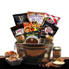 a bucket filled with food and snacks on top of a table