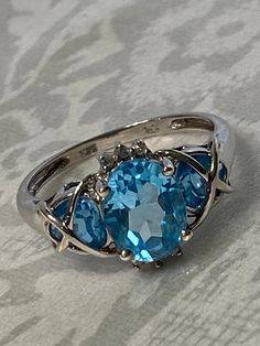 Fabulous !! 10k Solid White Gold Blue Topaz & Diamond Multi Stone Cocktail Ring.  Size- 8  Measures : 11.8mm widest  3 Topaz Stones : 1- 9x7mm                                    2- 4x3mm 6 Diamonds : 1mm each  Weight :  3  grams  Stamped:  10K & Markers Mark  Condition : very good condition  Thank you for Visiting! Topaz Stone, Multi Stone Ring, Multi Stone, Cocktail Ring, Stone Ring, Cocktail Rings, Stone Rings, Blue Topaz, Favorite Jewelry