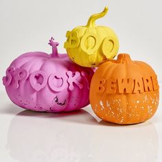 three halloween pumpkins with the words beware painted on them