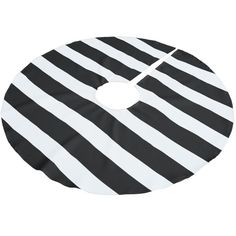 a black and white striped cloth with a hole in the middle that looks like a circle