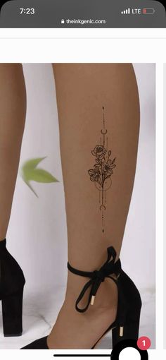 a woman's legs with tattoos on them and flowers in the middle of her leg