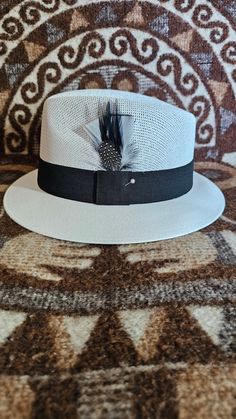 Handcrafted with the highest quality materials. Handmade flex fit technology to fit or adjust multiple head size. Very comfortable fit, self adjustable for the best fitting look. Hat style is perfect for special occasions or casual use.  Feather colors may vary in color, but we will try to meet your request as best as possible. All sales are final Hablamos Espanol Social Media: Instagram: @lowridingchicano Facebook: @lowridingchicano TikTok: @lowridingchicano Breathable Hats With Adjustable Fit And Short Brim, Adjustable Fit Breathable Hat With Short Brim, Breathable Short Brim Hat With Adjustable Fit, Adjustable Breathable Fitted Hat With Curved Brim, Breathable Short Brim Hat, One Size Fits Most, Breathable Hat With Short Brim, One Size Fits Most, Breathable Short Brim Hat One Size Fits Most, Adjustable Flat Brim Hat With Breathable Material, Adjustable Breathable Hat With Flat Brim