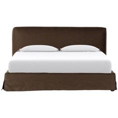 a bed with white sheets and brown headboard on it's side, in front of a white background