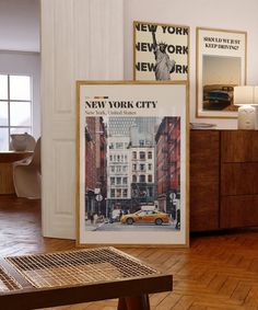 there is a new york city poster on the wall next to a table and chair