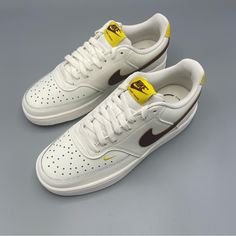 Chic And Comfortable: Nike Women's Court Vision Low - Sail/Yellow/Brown Size 8.5 Elevate Your Sneaker Game With The Nike Women's Court Vision Low In Sail/Yellow/Brown. This Stylish Sneaker Features A Lace-Up Closure And A Low-Top Shoe Shaft Style, Perfect For Both Casual And Activewear Occasions. The Leather Outsole Material Provides Durability, While The Leather Lining Material Adds A Touch Of Luxury. With A Solid Pattern And Colorful Accents, This Nike Court Model Showcases A Classic And Sport Luxury Brown Running Shoes For Sports, Yellow Perforated Sneakers For Streetwear, Yellow Sneakers With Perforations And Round Toe, Yellow Leather Sneakers With Perforations, Casual Low-top Sneakers With Yellow Stitching, Nike Mustard Round Toe Sneakers, Casual Yellow Sneakers With Perforated Toe Box, Yellow Sneakers With Perforated Toe Box, Gym School