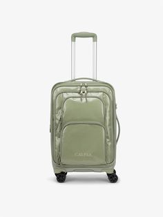 a green piece of luggage with wheels and handles on the handle, sitting against a white background